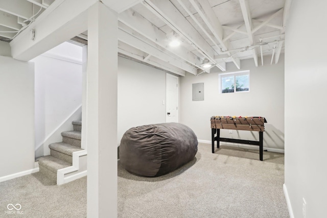below grade area with stairway, carpet flooring, and baseboards