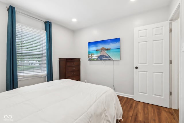 bedroom with recessed lighting, baseboards, and dark wood finished floors