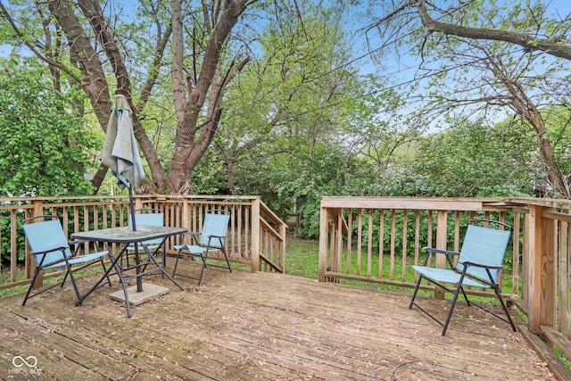 wooden deck with outdoor dining space