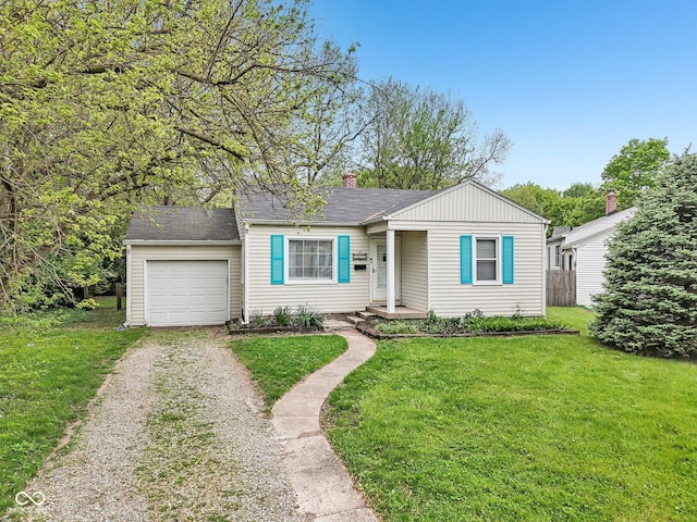 bungalow featuring an attached garage, driveway, a chimney, and a front lawn