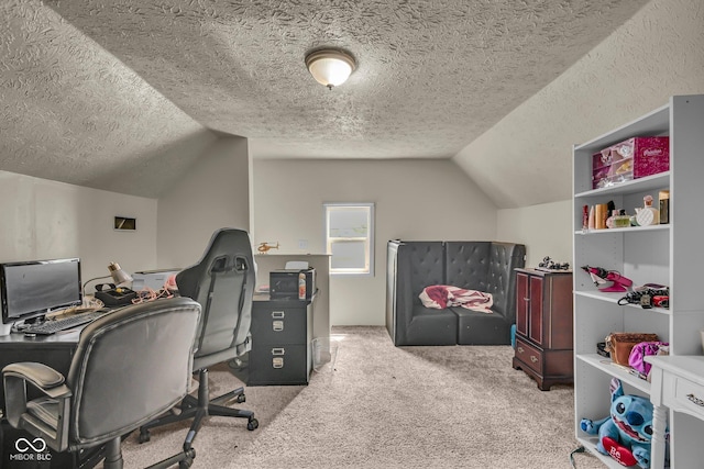 carpeted office featuring vaulted ceiling and a textured ceiling