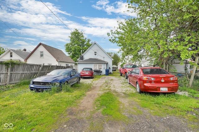 exterior space featuring fence and driveway