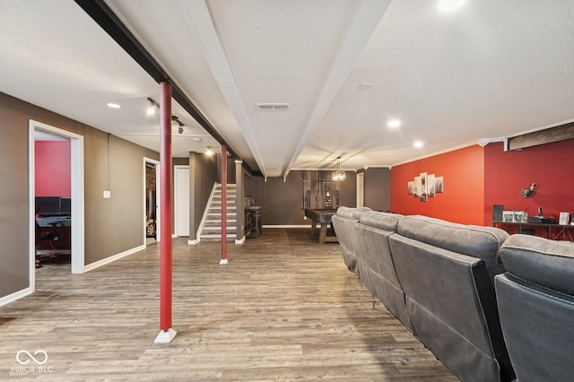 interior space with recessed lighting, baseboards, visible vents, and wood finished floors