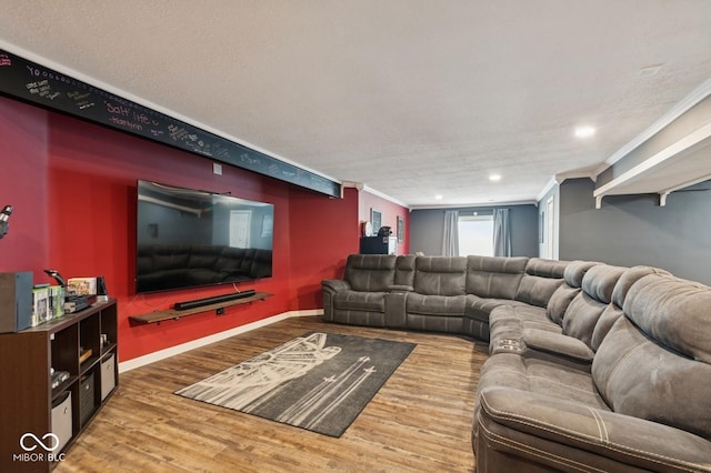 living area with baseboards, recessed lighting, crown molding, and wood finished floors