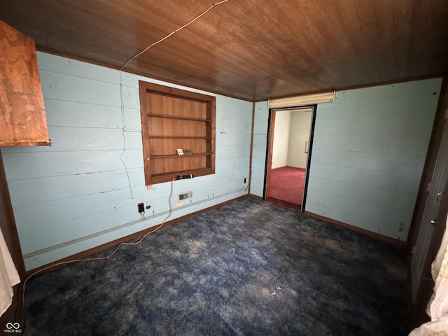 unfurnished bedroom featuring wood ceiling and a closet
