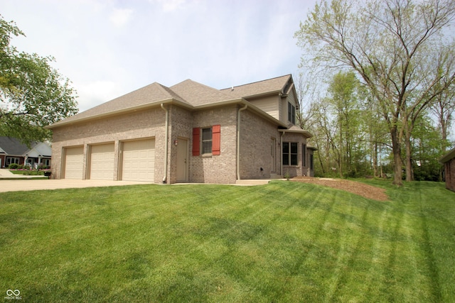 view of home's exterior featuring an attached garage, a lawn, concrete driveway, a shingled roof, and brick siding