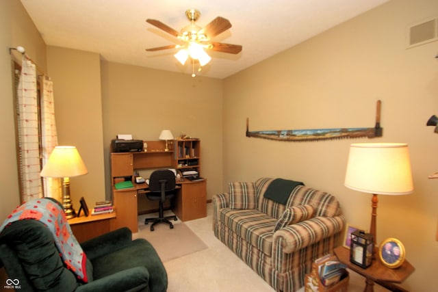 office space with a ceiling fan, visible vents, and carpet floors