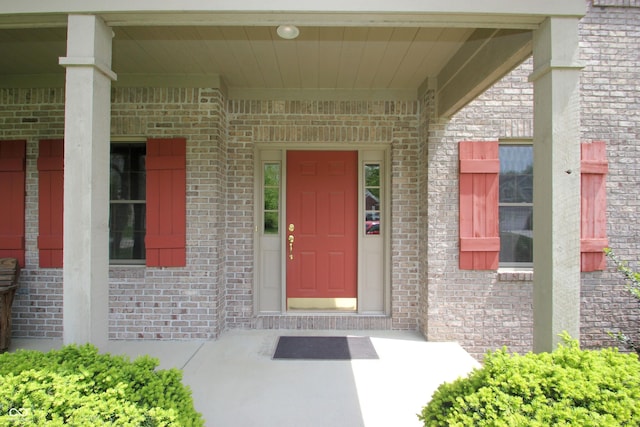 entrance to property with brick siding