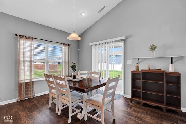 dining space featuring baseboards, a healthy amount of sunlight, visible vents, and wood finished floors