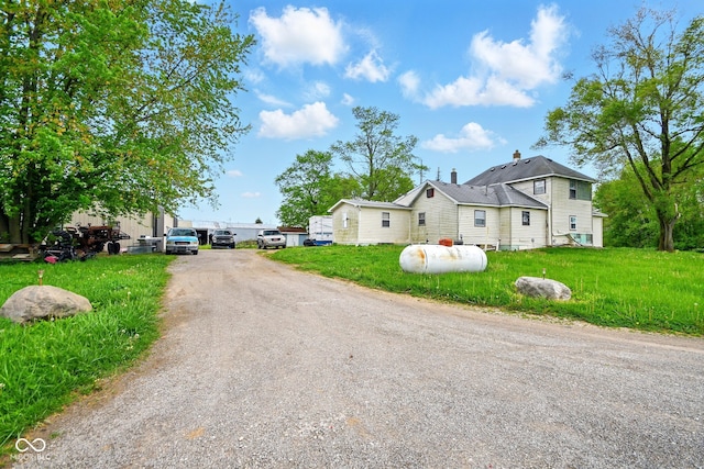 view of road with gravel driveway