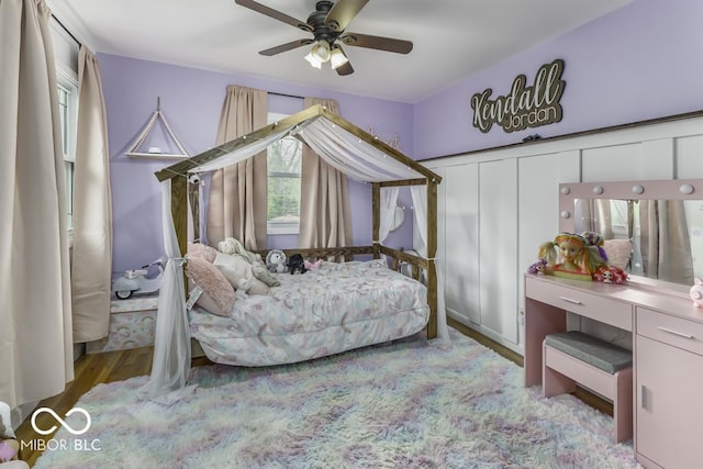 bedroom with wood finished floors and ceiling fan