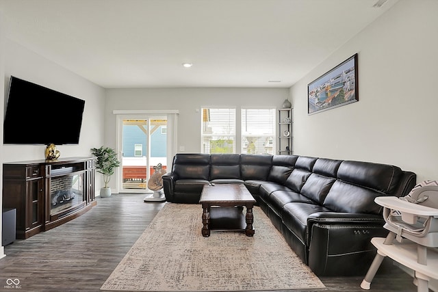 living area featuring recessed lighting and dark wood-style floors