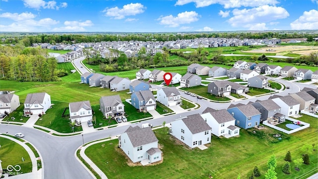 birds eye view of property with a residential view