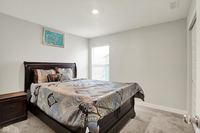 bedroom with light colored carpet, baseboards, visible vents, and recessed lighting