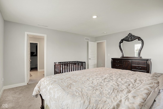 carpeted bedroom with visible vents, baseboards, and recessed lighting