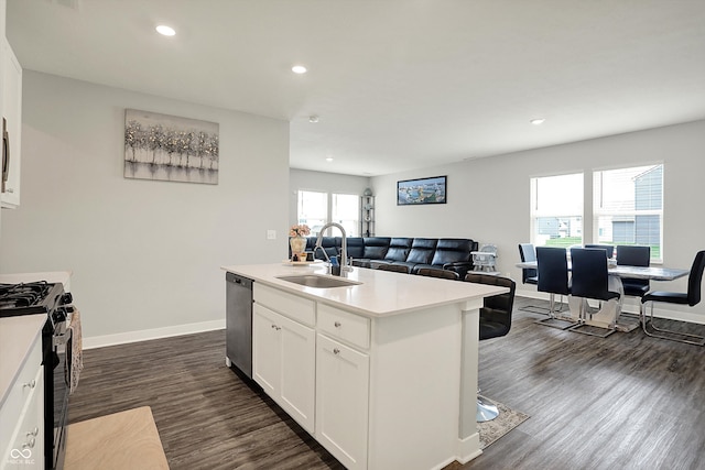 kitchen featuring range with gas stovetop, stainless steel dishwasher, recessed lighting, and a sink