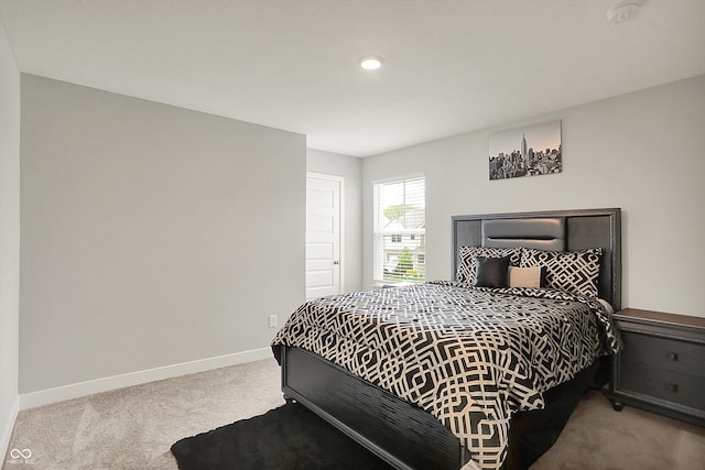 bedroom with baseboards, recessed lighting, and carpet floors