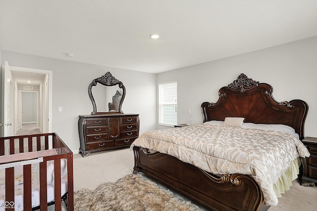 bedroom featuring recessed lighting, visible vents, and light colored carpet