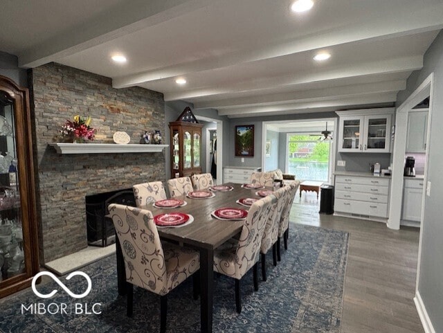 dining area featuring beamed ceiling, dark wood-type flooring, and recessed lighting