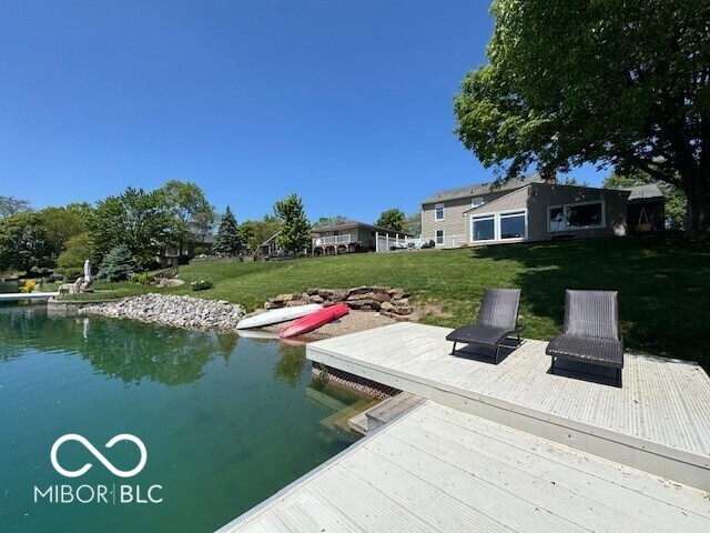 dock featuring a lawn
