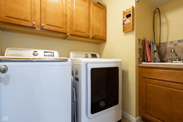 3829 Waycross Dr, Columbus, IN 47203 - laundry area featuring separate washer and dryer and cabinet space