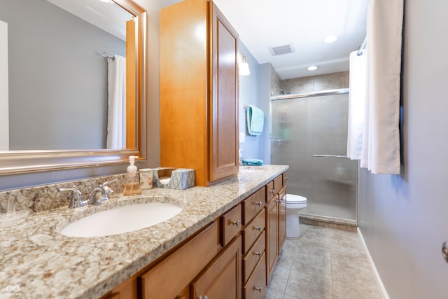 3829 Waycross Dr, Columbus, IN 47203 - bathroom featuring a stall shower, tile patterned flooring, toilet, vanity, and baseboards