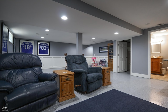3829 Waycross Dr, Columbus, IN 47203 - living room featuring wainscoting, recessed lighting, dark aggregate flooring, and baseboards