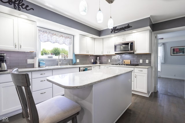 3829 Waycross Dr, Columbus, IN 47203 - kitchen featuring a sink, stainless steel appliances, white cabinets, ornamental molding, and dark wood-style flooring
