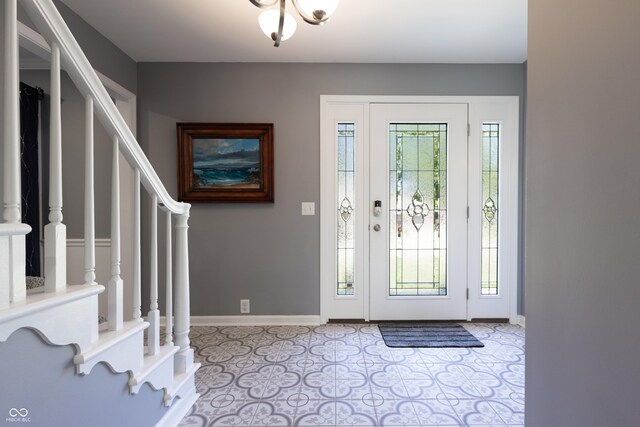 3829 Waycross Dr, Columbus, IN 47203 - foyer entrance with baseboards and stairway