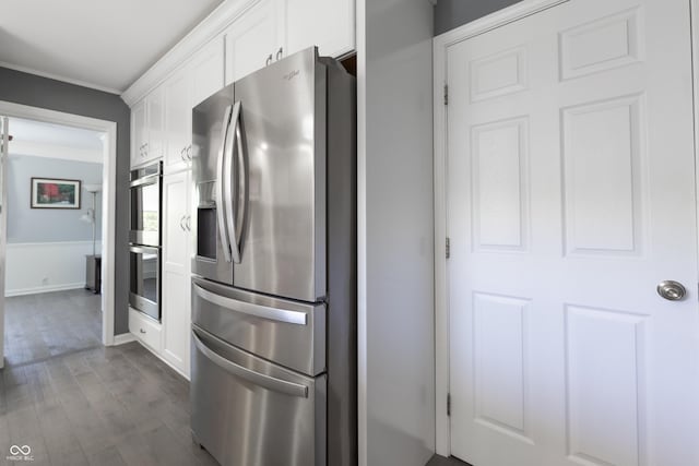 3829 Waycross Dr, Columbus, IN 47203 - kitchen featuring stainless steel appliances, white cabinetry, dark wood finished floors, ornamental molding, and baseboards