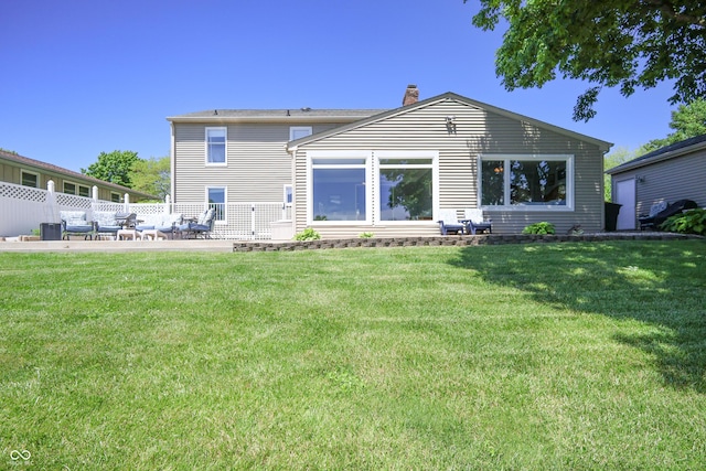 3829 Waycross Dr, Columbus, IN 47203 - rear view of property with a chimney, a patio area, and a yard