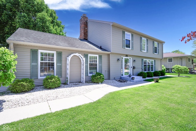 3829 Waycross Dr, Columbus, IN 47203 - colonial-style house featuring a front lawn and a chimney
