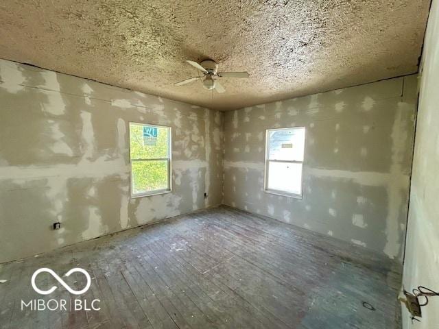 2701 N Gale St, Indianapolis, IN 46218 - unfurnished room with hardwood / wood-style floors and ceiling fan