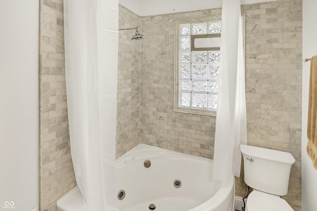 bathroom featuring a combined bath / shower with jetted tub and toilet