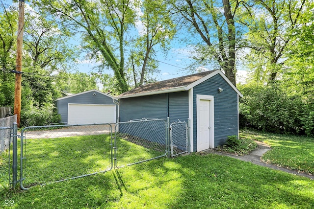 detached garage featuring a gate