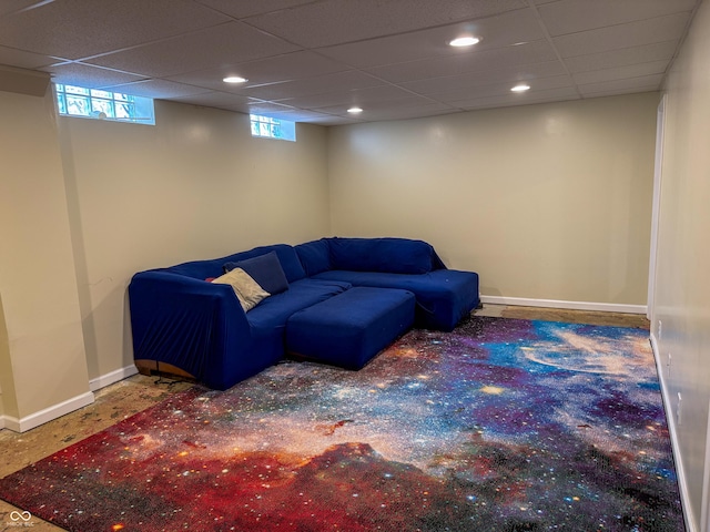 living room featuring baseboards and recessed lighting