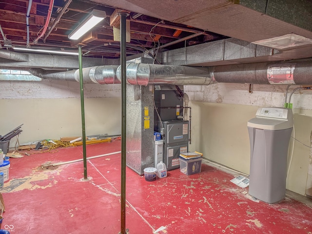 unfinished below grade area featuring a water softener system