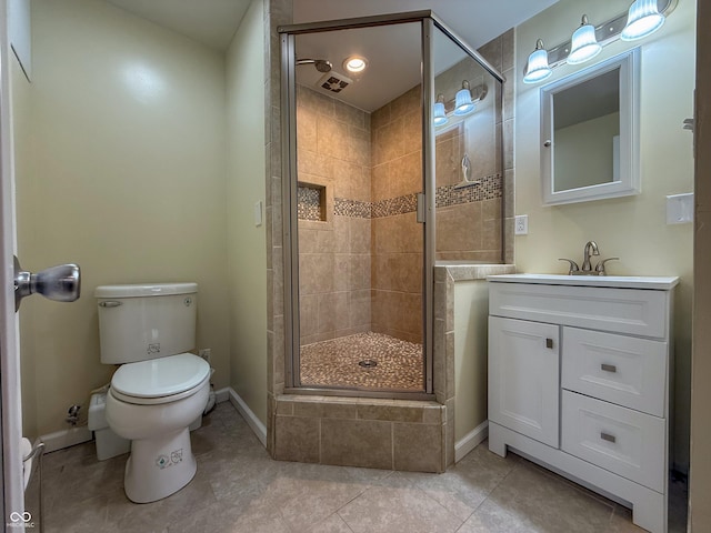 bathroom with a stall shower, toilet, baseboards, and vanity