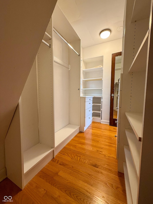 walk in closet featuring light wood-style flooring