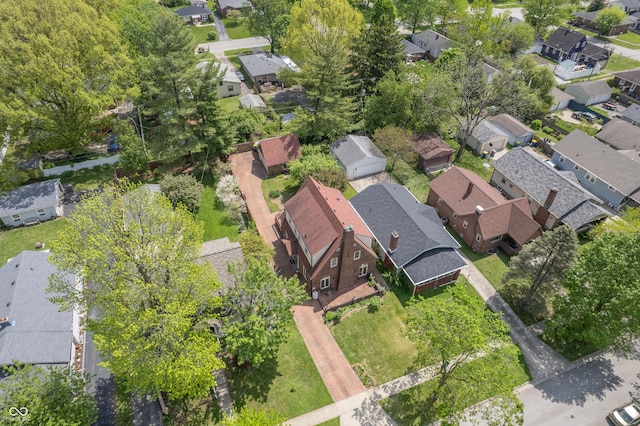 aerial view of property and surrounding area with nearby suburban area