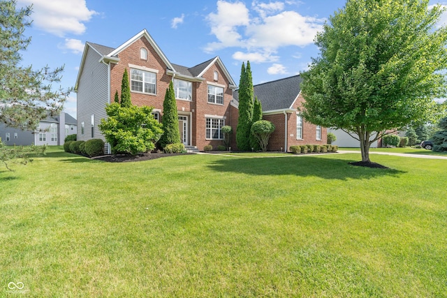 13553 Lorenzo Blvd, Carmel, IN 46074 - view of front facade featuring brick siding and a front yard