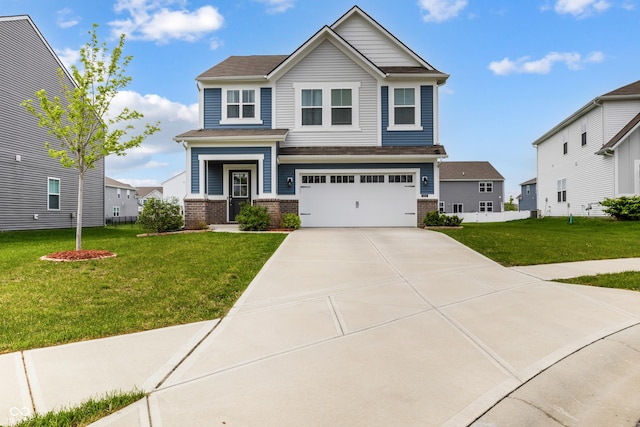 craftsman house featuring an attached garage, a front lawn, brick siding, and driveway