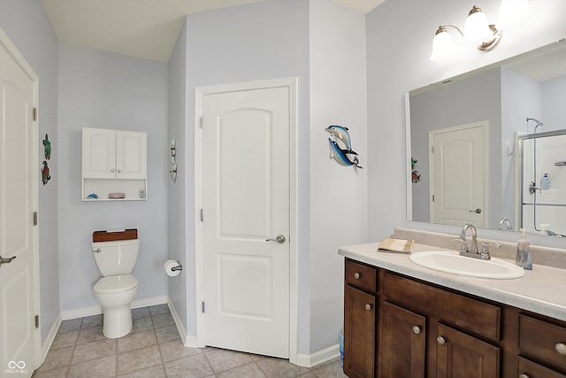 full bath featuring baseboards, toilet, vanity, and a shower with door