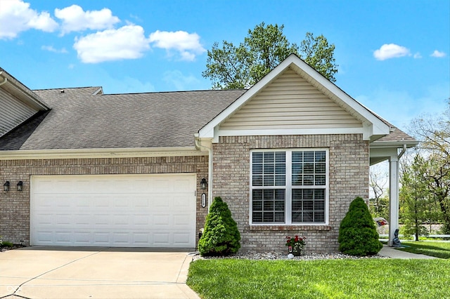 view of front of house with brick siding, a garage, concrete driveway, a shingled roof, and a front lawn