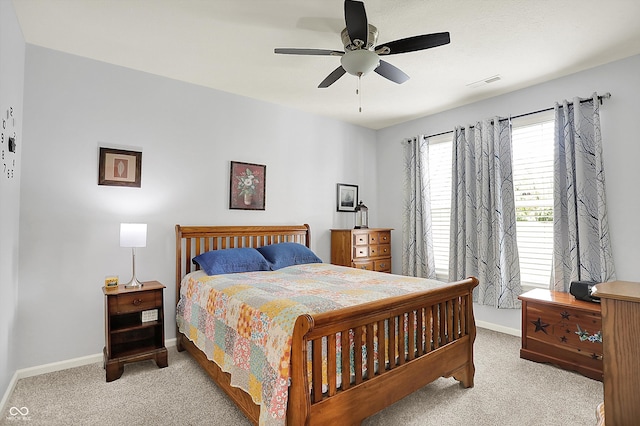 bedroom featuring carpet floors, baseboards, and ceiling fan