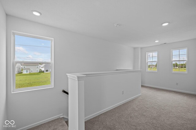 6219 Medina Spirit Dr, Indianapolis, IN 46237 - carpeted empty room with a smoke detector and recessed lighting