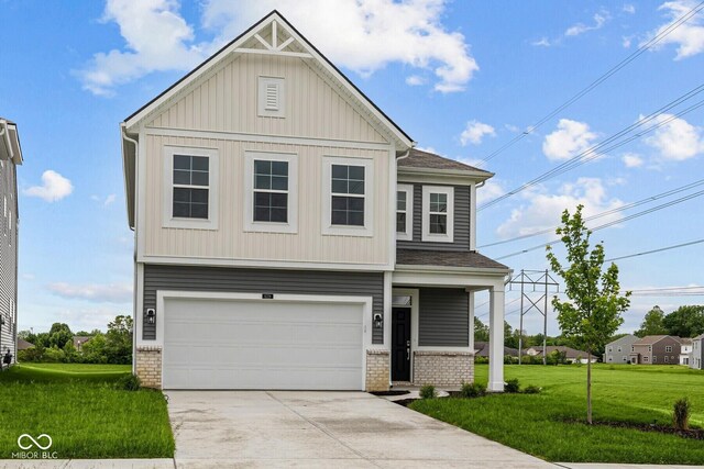 6219 Medina Spirit Dr, Indianapolis, IN 46237 - craftsman-style home with a front yard, an attached garage, concrete driveway, and brick siding