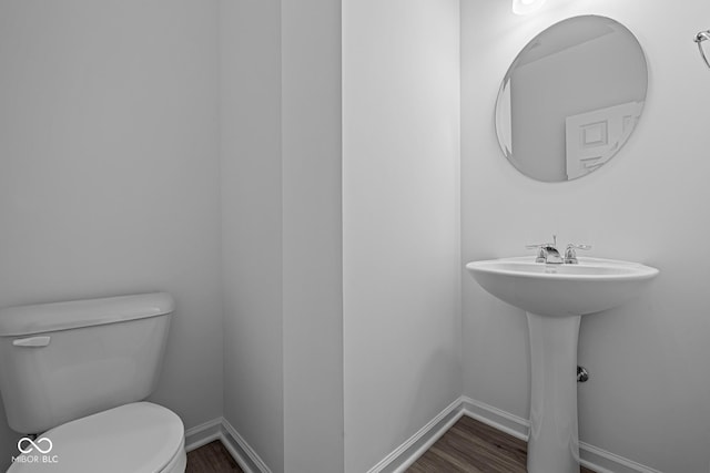 6219 Medina Spirit Dr, Indianapolis, IN 46237 - bathroom featuring toilet and wood finished floors