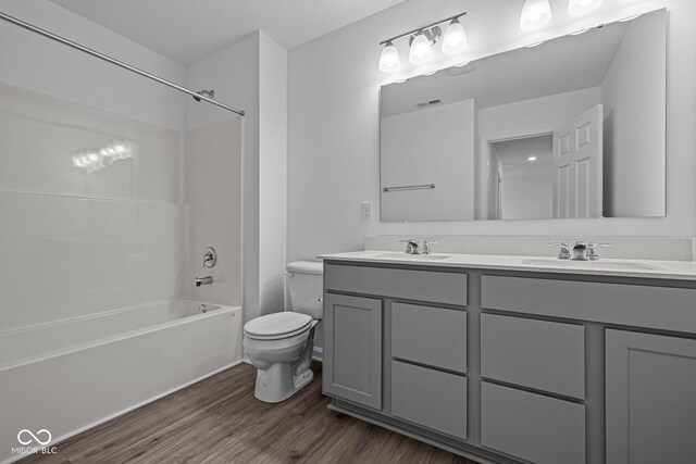 6219 Medina Spirit Dr, Indianapolis, IN 46237 - full bathroom with double vanity, wood finished floors, and  shower combination