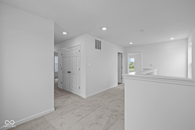 6219 Medina Spirit Dr, Indianapolis, IN 46237 - hall featuring light carpet and recessed lighting
